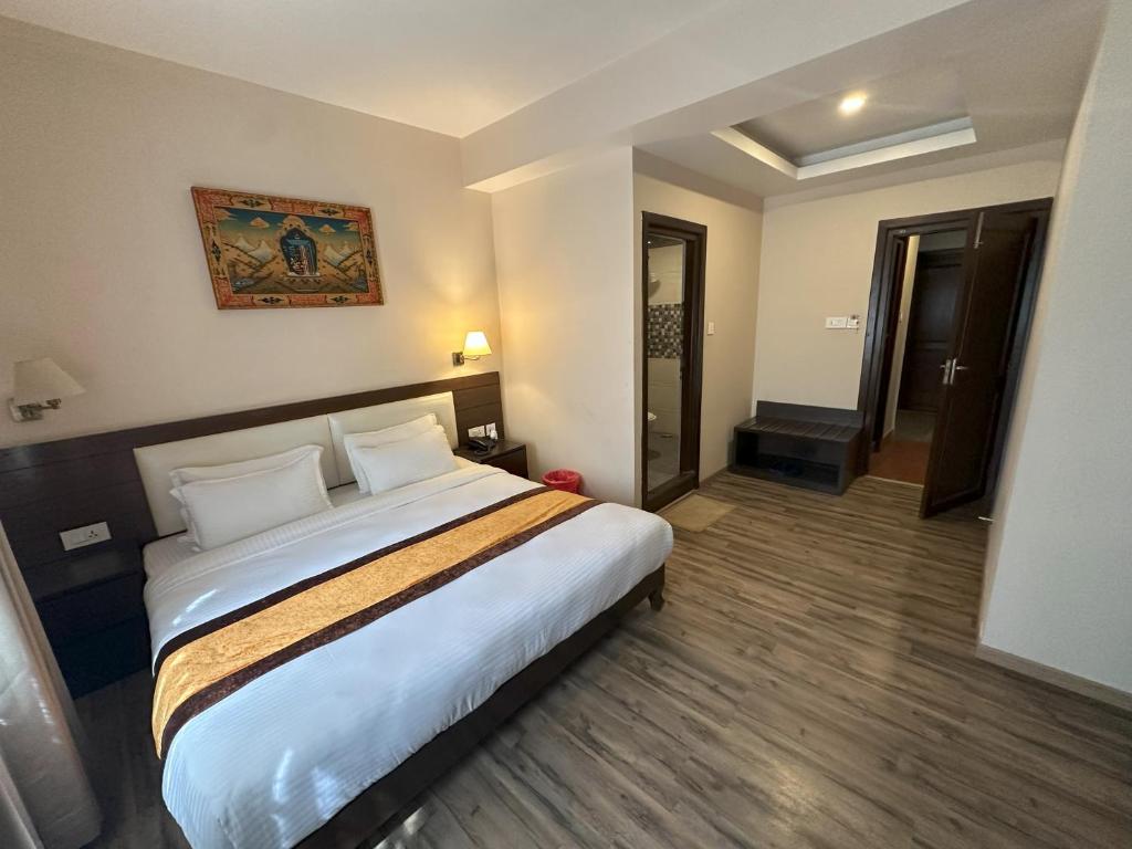 Postel nebo postele na pokoji v ubytování Hotel Shuman, Boudha