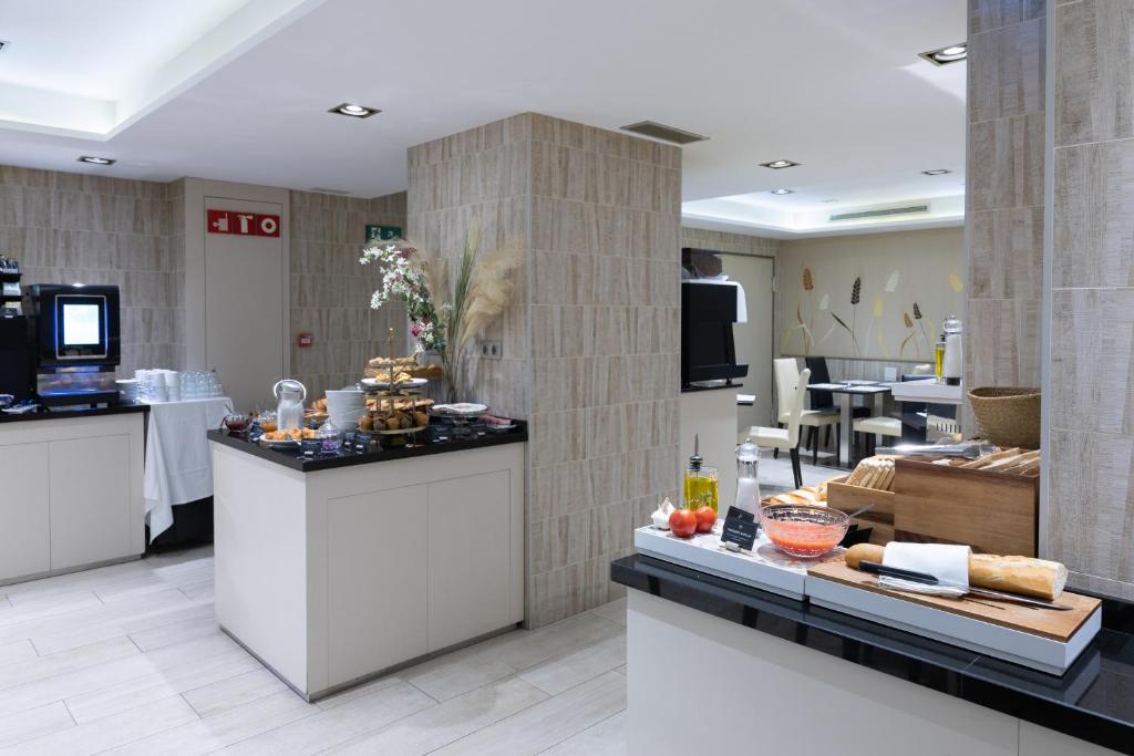 Kuchyň nebo kuchyňský kout v ubytování Hotel Santa Marta