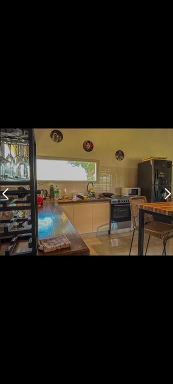 a kitchen with a pool in the middle of it at Casa mar chiquita in Mar del Plata
