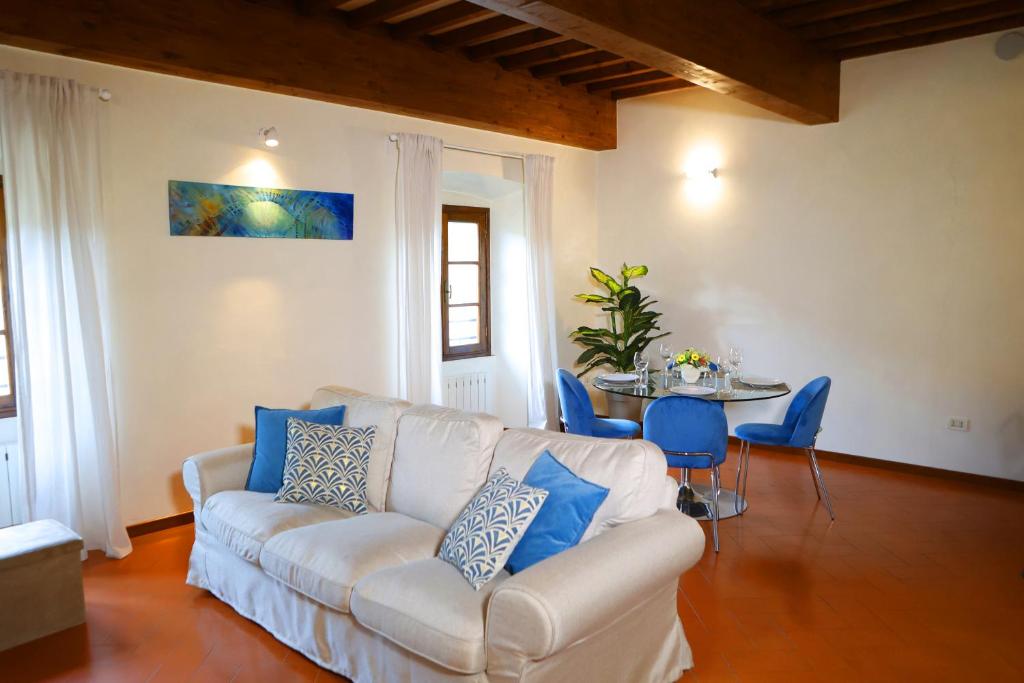 a living room with a couch and a table at Maison B in Prato