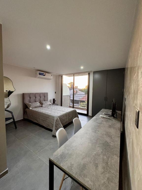 Ένα ή περισσότερα κρεβάτια σε δωμάτιο στο DPTO 205 Edif Loftier