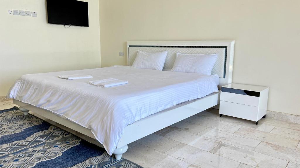 Voodi või voodid majutusasutuse Wadi Shab Beach Villa toas