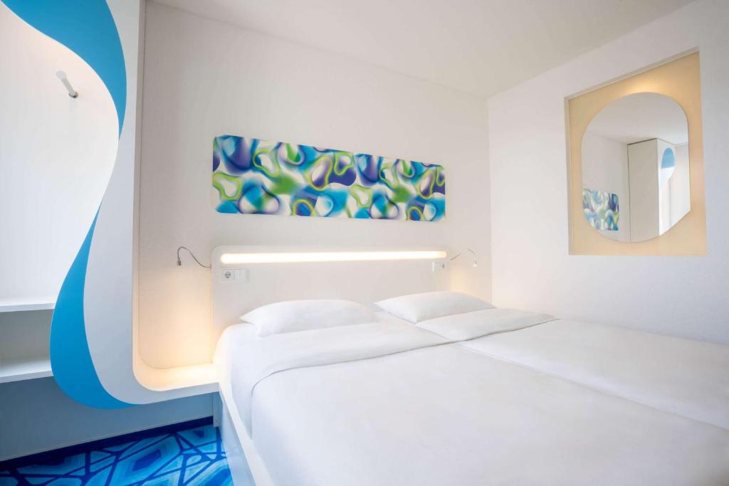 Postel nebo postele na pokoji v ubytování Prize by Radisson, Hamburg City