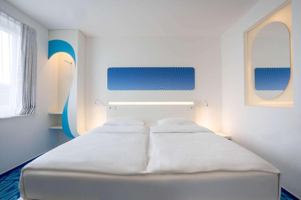 Postel nebo postele na pokoji v ubytování Prize by Radisson, Hamburg City