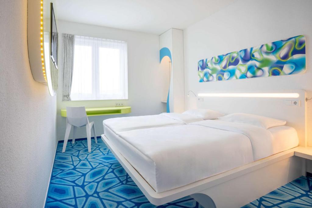 Postel nebo postele na pokoji v ubytování Prize by Radisson, Hamburg City