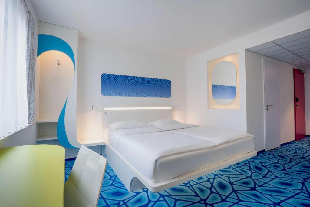 Postel nebo postele na pokoji v ubytování Prize by Radisson, Hamburg City