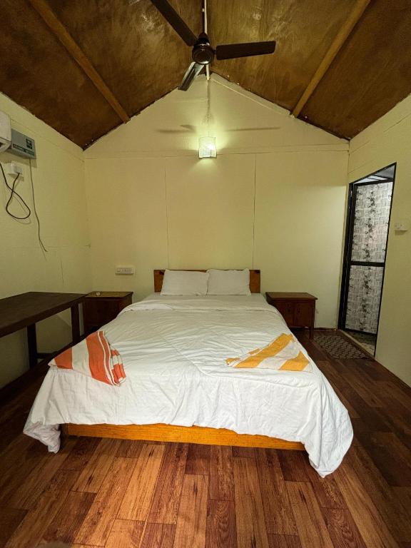 Postel nebo postele na pokoji v ubytování CSF GARDEN HUTS