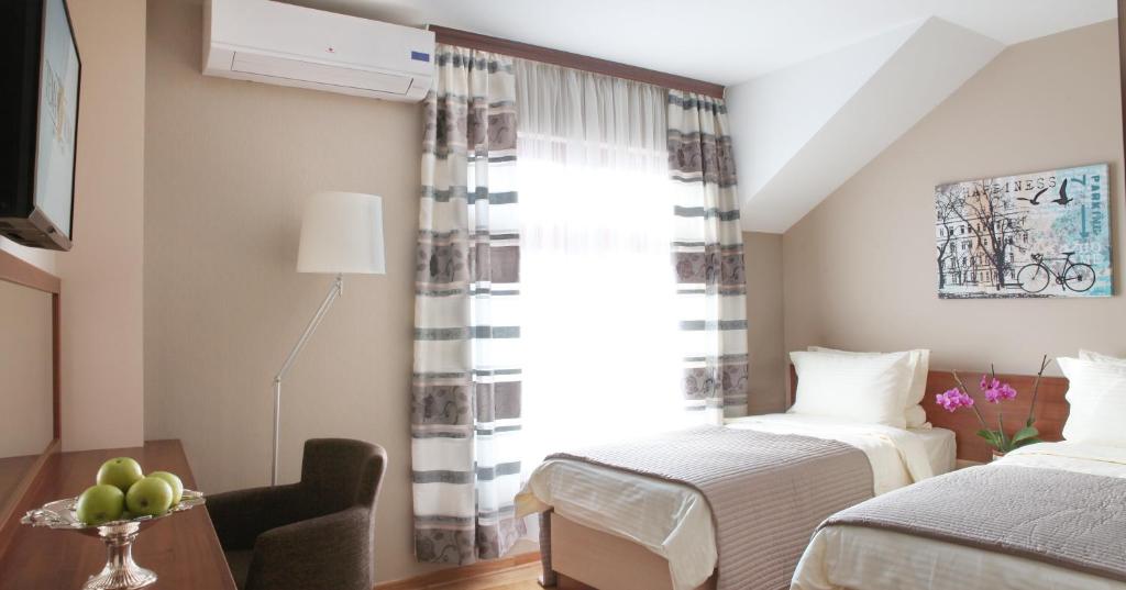 Postel nebo postele na pokoji v ubytování Hostel Tema Nova Centar