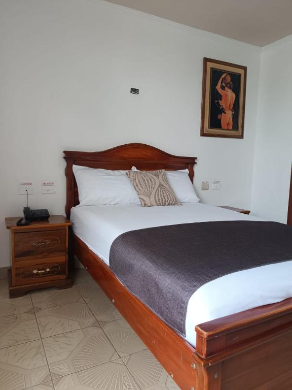 Postel nebo postele na pokoji v ubytování Hostal Bicentenario