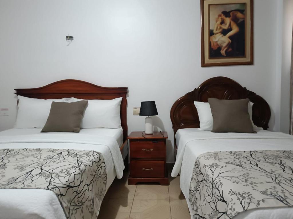 Postel nebo postele na pokoji v ubytování Hostal Bicentenario