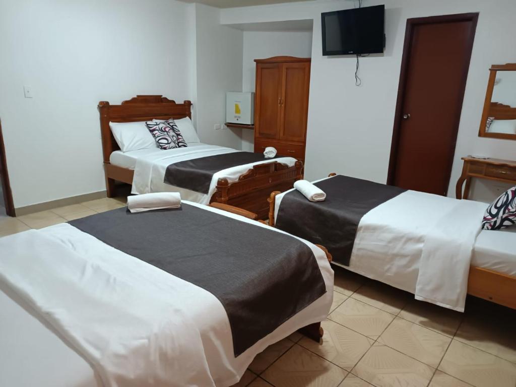 Postel nebo postele na pokoji v ubytování Hostal Bicentenario