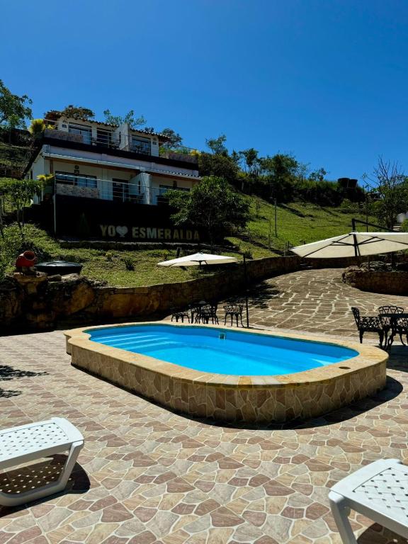 a swimming pool in the middle of a patio at Finca Guacari (San Gil) in San Gil