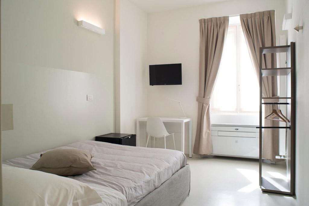 Posteľ alebo postele v izbe v ubytovaní L'Ottava GuestHouse