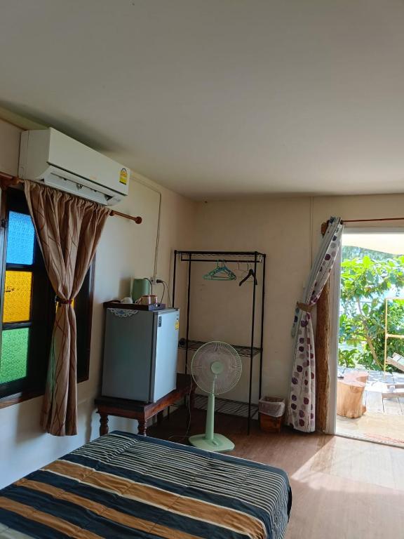 Postel nebo postele na pokoji v ubytování TK Beach Resort Koh Mak