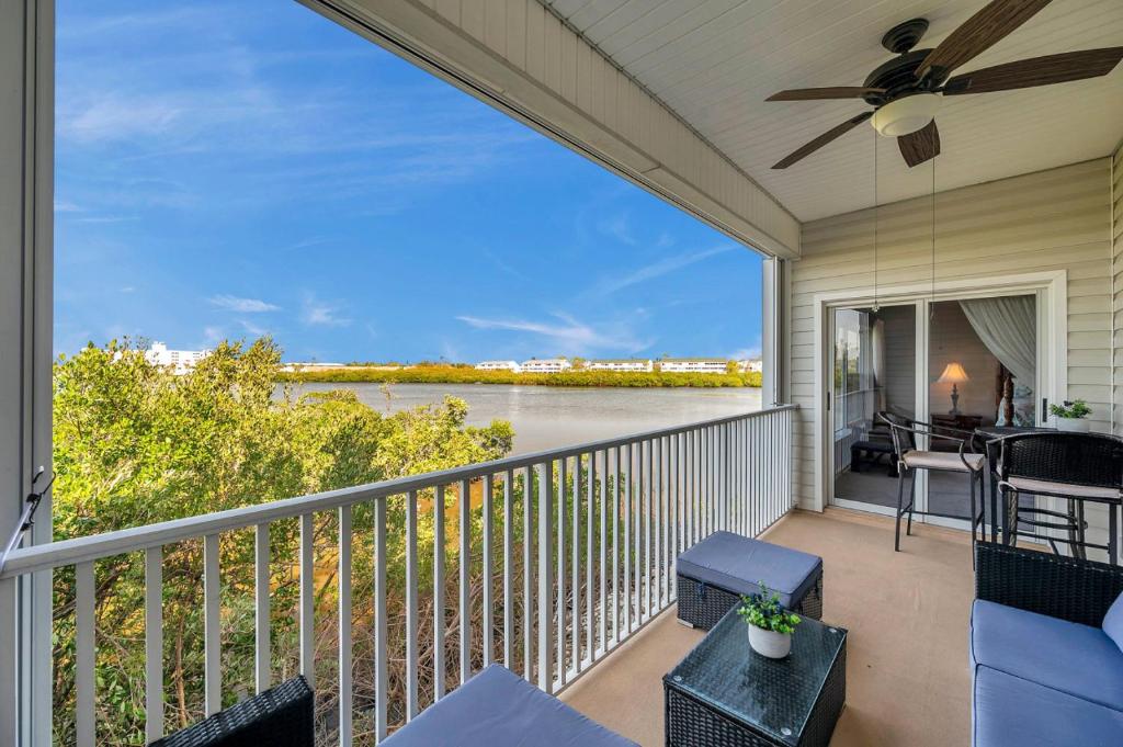 a balcony with a view of the water at Mariners Pointe 702 in Clearwater Beach