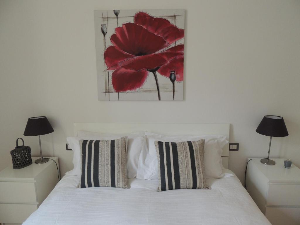 A bed or beds in a room at Casa Rinuccini