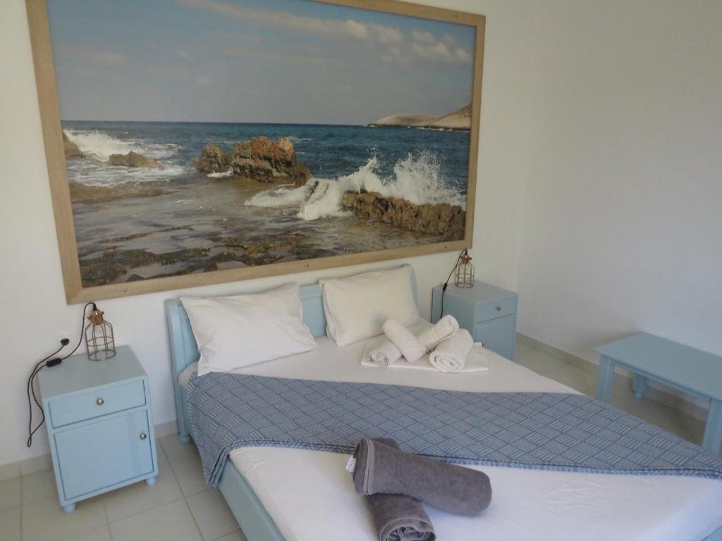Кровать или кровати в номере Blue Beach Villas Apartments