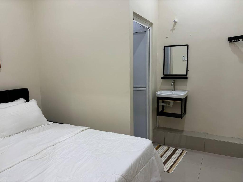 Una cama o camas en una habitación de SZ Hotel