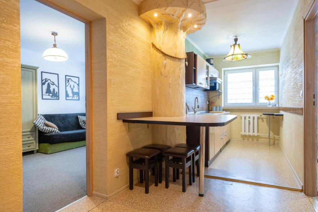 Posedenie v ubytovaní APARTAMENT NAD KAMIEŃCZYKIEM IV