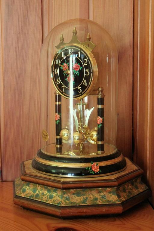 a clock sitting on top of a wooden table at Discover Italy in Tignes