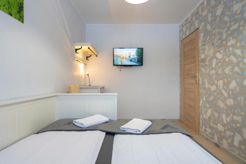 Posteľ alebo postele v izbe v ubytovaní APARTAMENT NAD KAMIEŃCZYKIEM IV