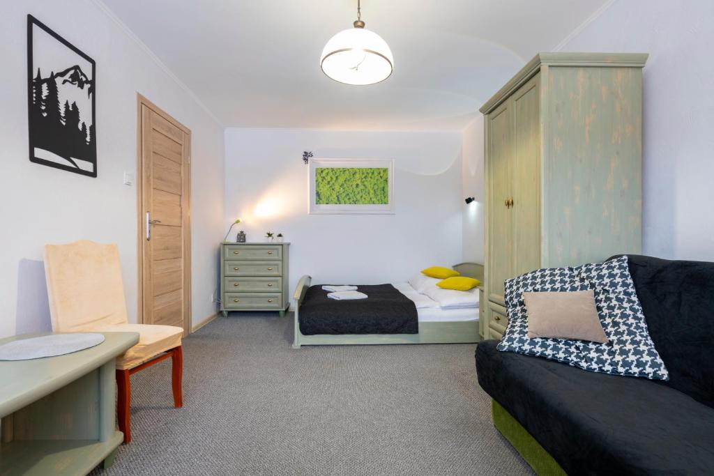 Posteľ alebo postele v izbe v ubytovaní APARTAMENT NAD KAMIEŃCZYKIEM IV