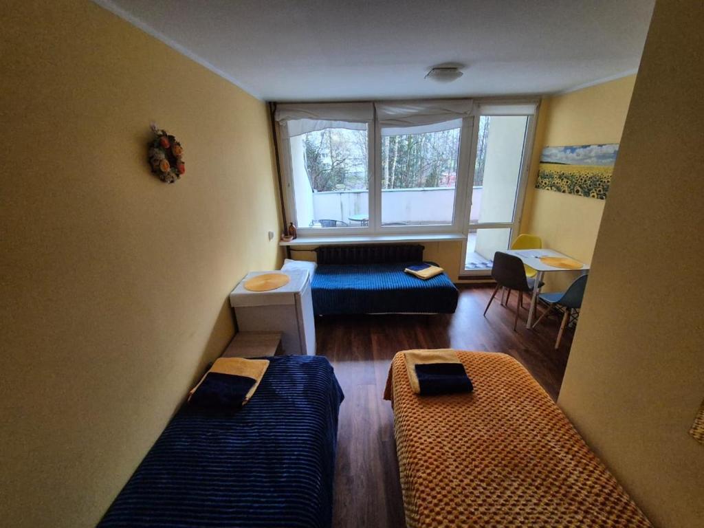 Postel nebo postele na pokoji v ubytování Travel House Wroclaw