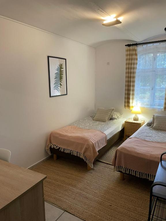 Postel nebo postele na pokoji v ubytování Villa Brzozowy Gaj