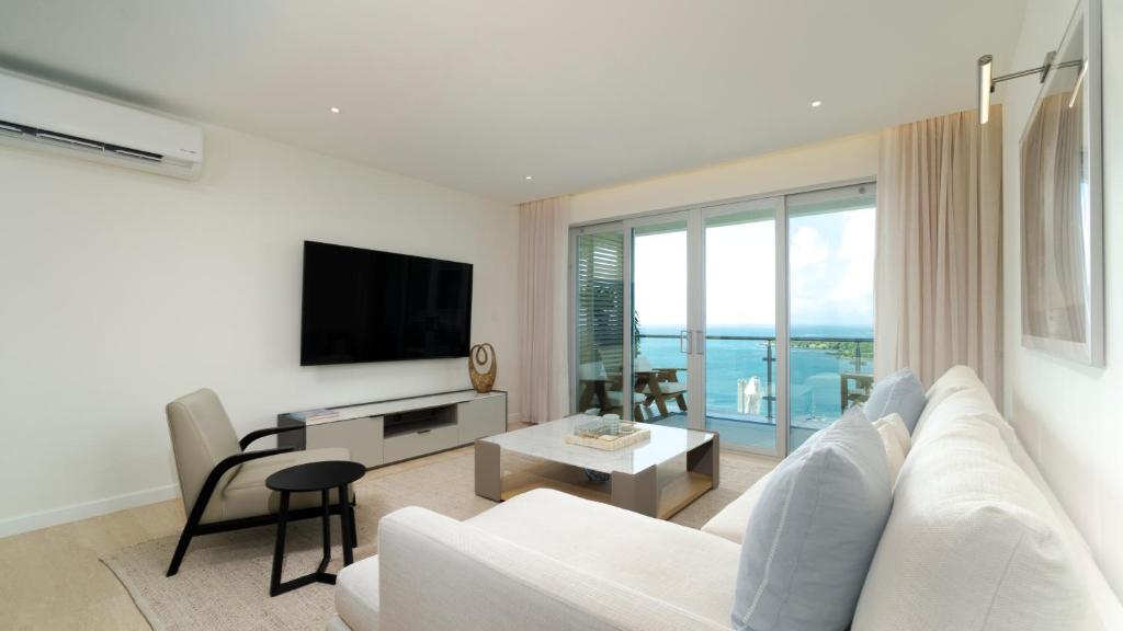 TV a/nebo společenská místnost v ubytování Amethyst Ocean View Condo