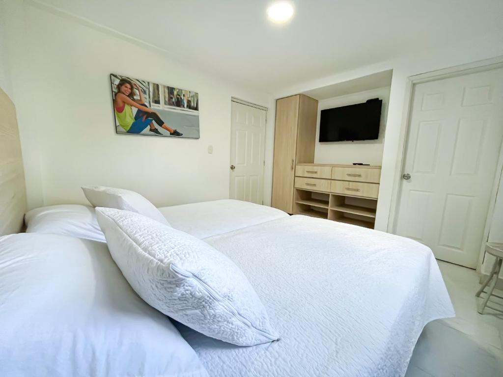Postel nebo postele na pokoji v ubytování Las Estrellas Agrohotel
