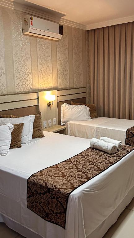 Ένα ή περισσότερα κρεβάτια σε δωμάτιο στο Sonus Hotel