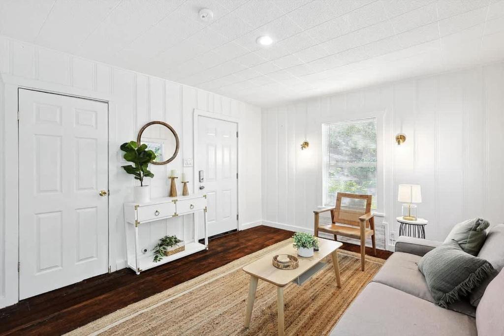 a living room with a couch and a table at Comfy Holiday Loft 8min from Downtown FW in Fort Worth