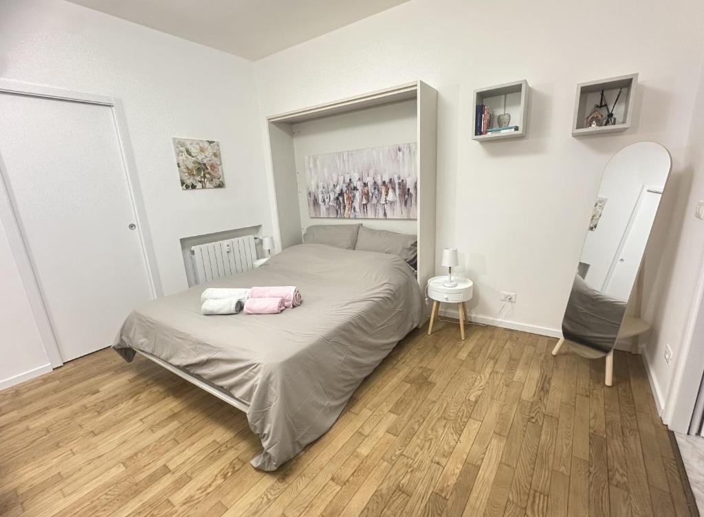 a small bedroom with a bed and a mirror at Lena Apartment Your Venice Gateway in Mestre in Mestre