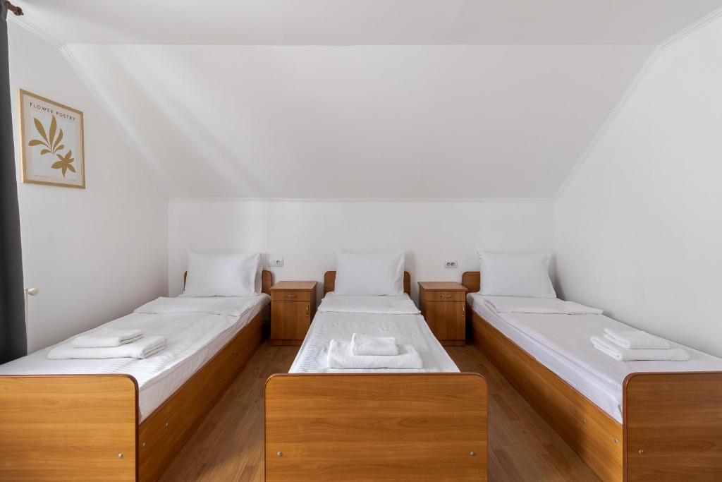 Postel nebo postele na pokoji v ubytování Robert Hotel