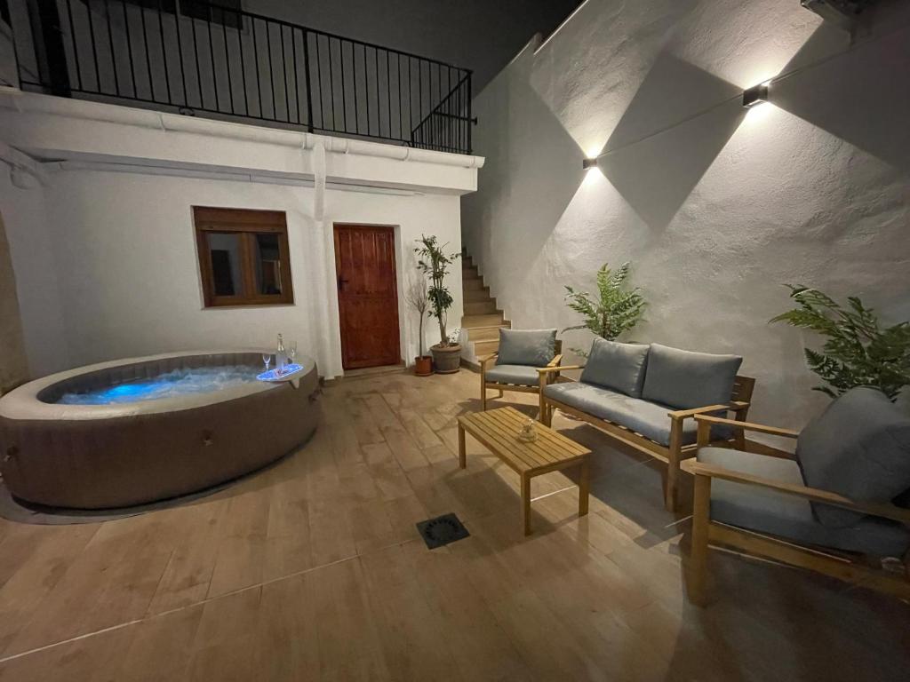 a large living room with a tub in the middle at Dream Big with jacuzzi and terrace in Ruzafa in Valencia