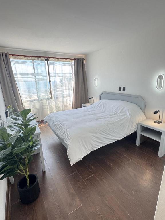 Postel nebo postele na pokoji v ubytování Hotel Camino del Alto Reñaca