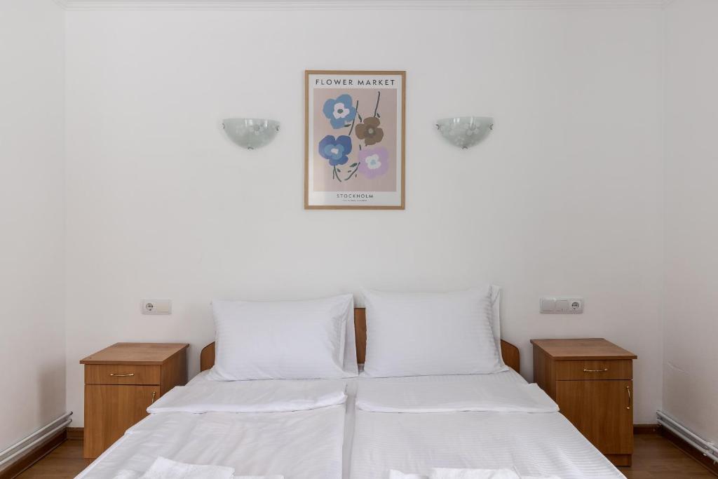 Postel nebo postele na pokoji v ubytování Robert Hotel