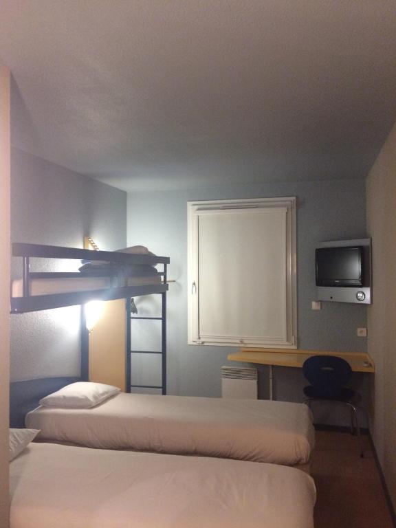 Postel nebo postele na pokoji v ubytování ibis budget Bar le Duc