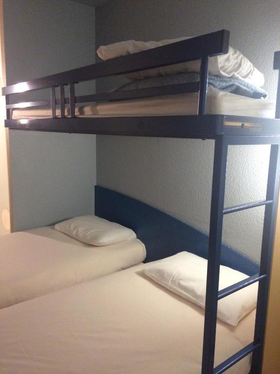 Postel nebo postele na pokoji v ubytování ibis budget Bar le Duc