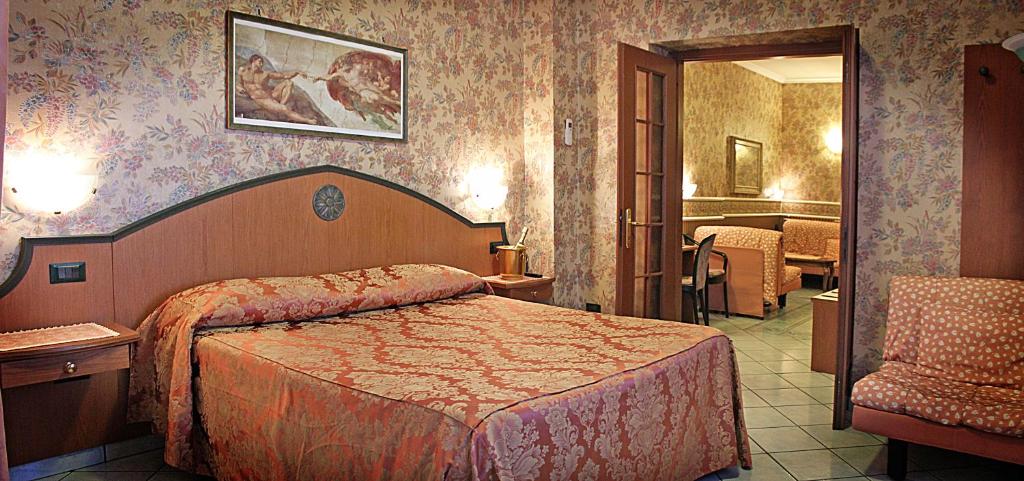 Postel nebo postele na pokoji v ubytování Hotel Nespolo D'Oro