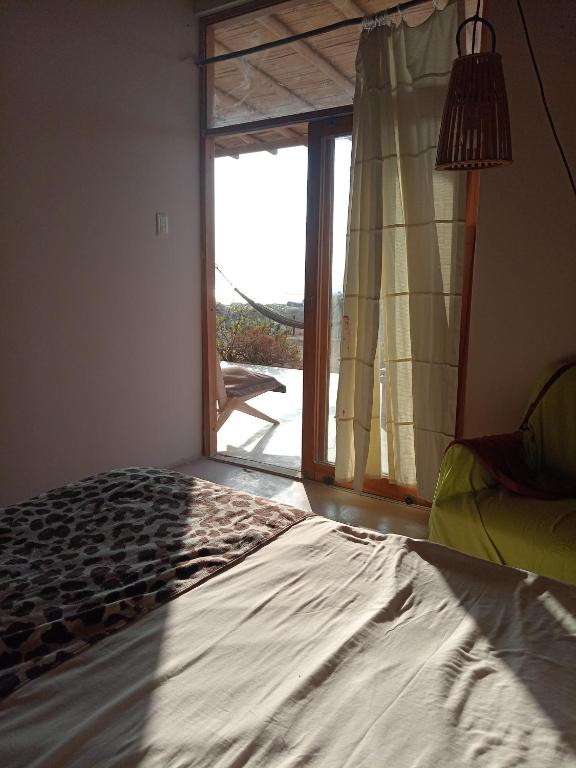 Postel nebo postele na pokoji v ubytování Punta Vichayo - Casa Ballenas