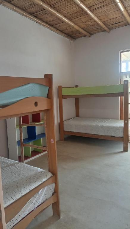 Postel nebo postele na pokoji v ubytování Punta Vichayo - Casa Ballenas
