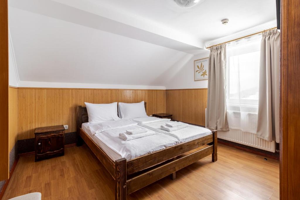 Postel nebo postele na pokoji v ubytování Robert Hotel