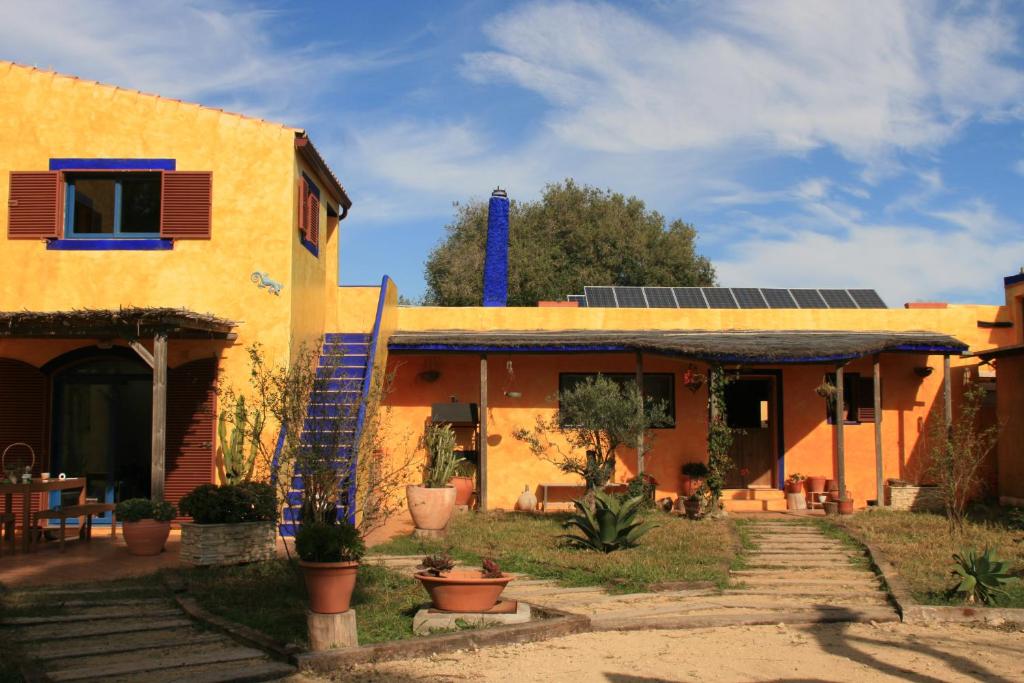 a house with solar panels on the roof at El Vuelo de la Libélula in Barbate