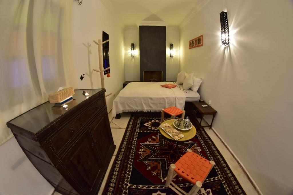 Postel nebo postele na pokoji v ubytování Riad Iklil
