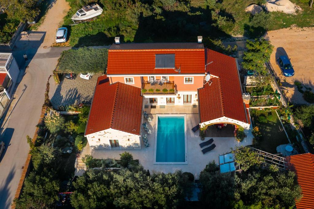 an overhead view of a house with an orange roof at Villa Pamaroka in Šibenik