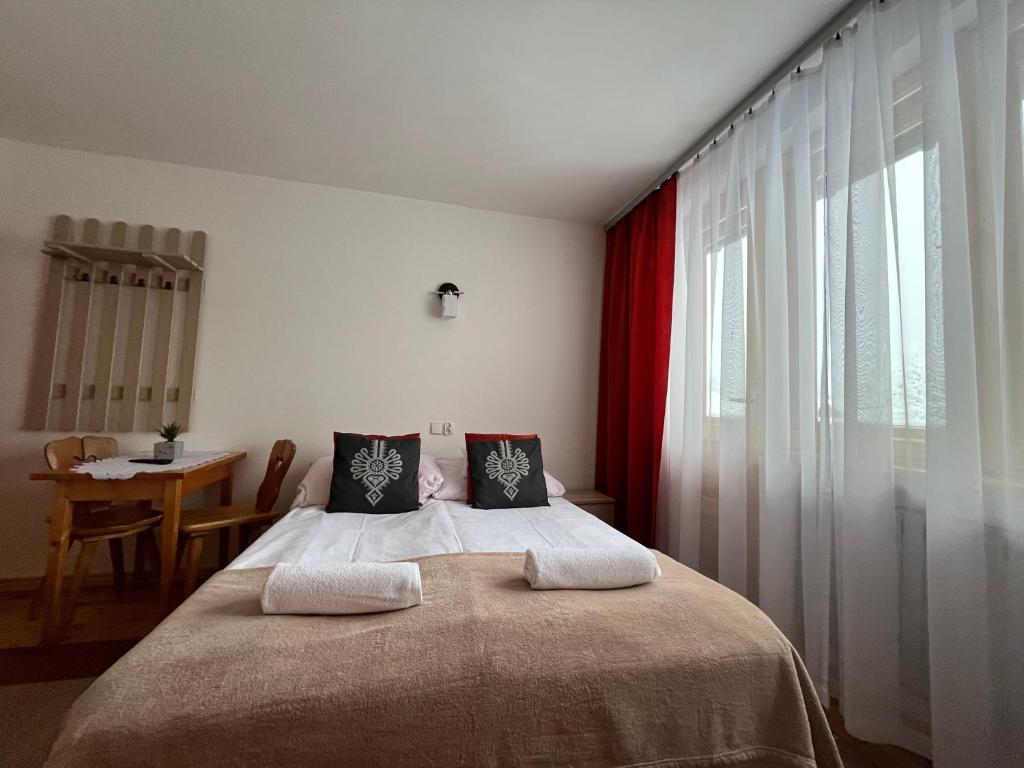 Posteľ alebo postele v izbe v ubytovaní Pokoje Gościnne Maria