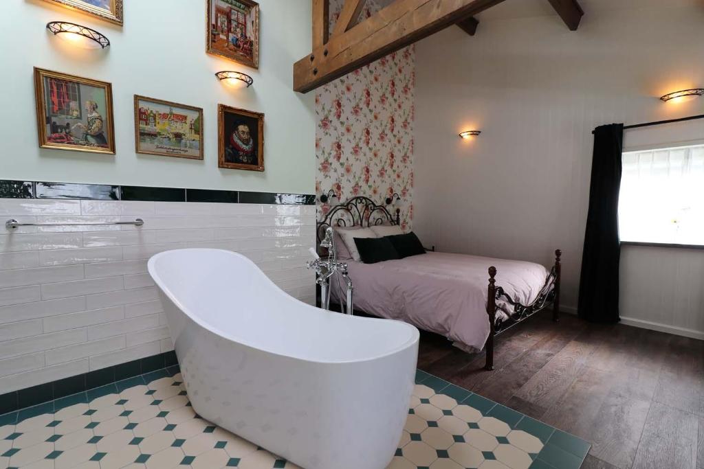 Postel nebo postele na pokoji v ubytování B&B Eemswolde