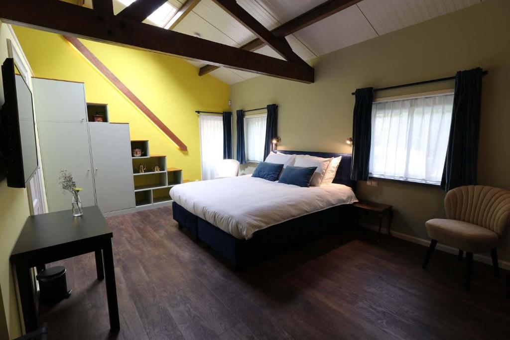 Postel nebo postele na pokoji v ubytování B&B Eemswolde
