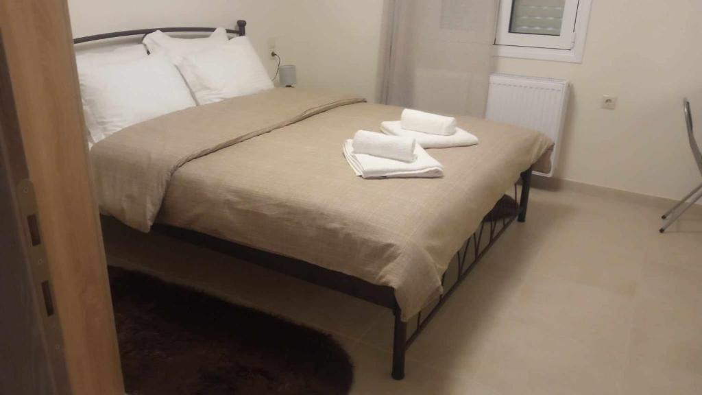 Postel nebo postele na pokoji v ubytování Galini Home